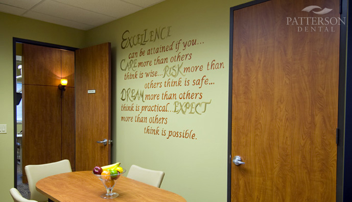 A hand-painted poem on the staff lounge wall captures Dr. Garner's vision for excellence.